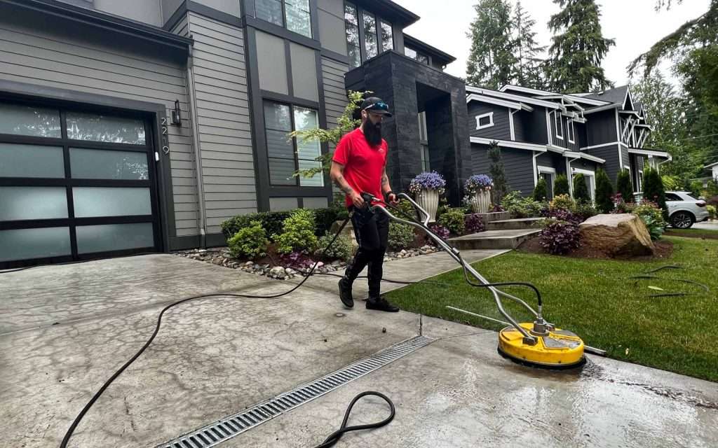 pressure cleaning driveway with machine